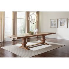 a wooden table sitting on top of a hard wood floor