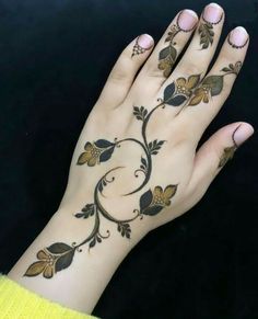 a woman's hand with tattoos on it