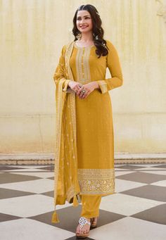 Desai mustard silk pant style suit in Prachi colour 16803  Desc:  Style : Pant Style Suits Color : Mustard Fabric : Silk Work : Embroidery Wash Care : Dry clean Sleeve Style : Full Sleeve Long Sleeves : Done only in Custom Stitch Sleeves Lining : Done only in Custom Stitch Bust Size : 32 to 42 Inches Occasion : Festival   Christmas   Diwali   Eid   Ceremonial   Ganesh Charturthi   Dussehra. With Express Free Shipping and Custom Stitching, Buy Indian Party wedding wear bridal salwar Desai mustard Bridal Salwar, Prachi Desai, Celana Fashion, Mustard Fabric, Stylish Kurtis Design, Salwar Suits Party Wear, Simple Lehenga, Yellow Suit, Silk Pant