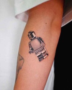 a small tattoo on the arm of a woman's arm with an image of a car