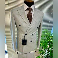 Light Grey Double-Breasted Suit, Slim Fit With Peak Lapel Design. Made In Europe. 80% Wool, 20% Polyester. A Versatile Must Have Color To Your Wardrobe. Size 52eu/42us Chest - 42 Inches Waist - 36 Inches Designer Fitted Suit With Double Button Closure, Designer Fitted Suits For Office, Designer Fitted Double Breasted Suit, Designer Double Breasted Fitted Business Suit, Designer Double Breasted Fitted Suit For Business, Designer Double Breasted Business Suit, Designer Fitted Double Breasted Business Suit, Designer Fitted Double Breasted Suit For Work, Fitted Double-breasted Office Suits