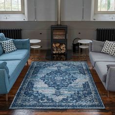 a living room filled with furniture and a fire place