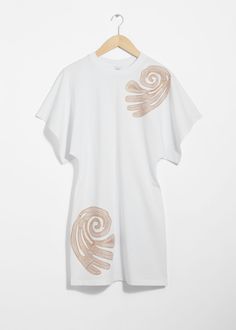 T-shirt mini dress featuring an accentuated waistline. Detailed with duo embroidered motifs.• Crewneck neck• Wide, short sleeves• Vertical centre front seam• Length of dress:85.5cm / 33.7" (Size S) White Cotton Short Sleeve T-shirt Dress, White Cotton T-shirt Dress With Short Sleeves, White Crew Neck Mini Dress For Summer, Embroidered Short Sleeve Mini Dress, Cotton Embroidered Short Sleeve Mini Dress, White Fitted Short Sleeve T-shirt Dress, Louis Vuitton Taschen, Embroidered Motifs, Summer Style Guide