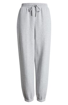 Work out or chill out in these comfy cotton-blend joggers designed with an easy tie waist. 29" inseam; 12" leg opening; 12 1/2" front rise; 16" back rise (size Medium) Elastic/drawstring waist 68% cotton, 32% recycled polyester Machine wash, tumble dry Imported Not available for sale and shipment to Germany Spring Cotton Joggers With Ribbed Waistband, Spring Cotton Joggers For Loungewear, Comfy Cotton Sweats For Spring, Spring Cotton Joggers For Athleisure, Cotton Sweats With Elastic Waistband For Spring, Trendy Cotton Joggers For Lounging, Spring Cotton Sweats With Ribbed Waistband, Elevated Casual Cotton Sweatpants With Comfort Waistband, Spring Cotton Joggers With Comfort Waistband