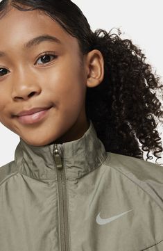 Breathable mesh and lightweight construction mean a comfortable fit in this kid-size jacket that'll keep young athletes warm on and off the playground. Front zip closure Stand collar Elastic cuffs Elastic waist Front welt pockets Lined 58% cotton, 40% polyester, 2% spandex with durable water-repellent (DWR) finish Machine wash, line dry Imported Green Sporty Track Jacket For Hiking, Sporty Green Track Jacket For Hiking, Casual Spring Training Track Jacket, Casual Gym Outerwear In Recycled Polyester, Nike Winter Training Outerwear, Nike Winter Outerwear For Training, Sporty Nylon Track Jacket For Hiking, Casual Nylon Windbreaker For Training, Sporty Half-zip Hiking Outerwear