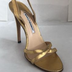 Manolo Blahnik - Metallic Gold - Heel Height: 4.25” - Size: 38 - Strappy Sandal - Brand New - Never Been Worn - See Minor Damage On Back Of Heel Please See My Other Items Metallic Gold Heels, Gold Strappy Sandals, Gold Heels, Sandals Brands, Strappy Sandals, Manolo Blahnik, Shoes Women Heels, Gold Metal, Heel Height