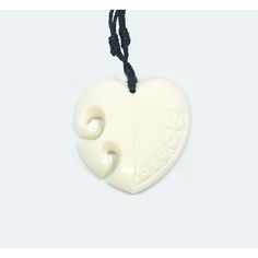 A handmade carved Bone Heart engraved necklace. Carved with great details and bound to be one of Makana Hut's favorite items. >Heart Pendant >Size: Approximately 1-1/2 inch tall x 1-1/2 inches wide >Engraving on Heart >Includes adjustable cord >Material: Bone >Handmade Symbolic Carved Necklace For Gifts, Artisan Carved Necklaces As A Gift, Symbolic Engraved Heart Pendant Necklaces, Symbolic Engraved Heart Pendant Necklace, Symbolic Heart Pendant Necklace Engraved, White Engraved Heart Necklaces, Heart-shaped Carved Jewelry Gift, Heart Shaped Carved Jewelry Gift, Carved Heart Jewelry Gift