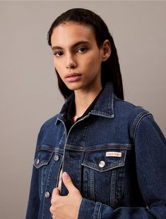 An essential denim jacket crafted from cotton stretch denim for an effortless, comfortable fit. Made with long sleeves, a point collar, and button closures along the front. Features dual chest pockets and finished with topstitching details for structured shape.  Material: 79% Cotton, 20% Recycled Cotton, 1% Elastane. Denim Trucker Jacket, Trucker Jacket, Recycled Cotton, Chest Pocket, Stretch Denim, Denim Jacket, Calvin Klein, Comfort Fit, Collar