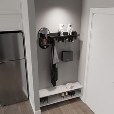 there is a shelf that has items on it in the corner next to a refrigerator