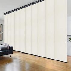 a modern living room with white vertical blinds