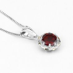 "Garnet Pendant, Natural Red Garnet Round and White Diamonds Pendant Necklace in Sterling Silver & 14K Yellow Gold, January Birthstone Flaunt Yourself With This Garnet And White Diamond halo Pendant. The Natural Gemstones Have A Combined Weight Of 2.32 Carats And Are Set In 14K Yellow Gold With .925 Sterling Silver. The Red Hue Of This Pendant Necklace Adds A Pop Of Color To Any Look! The Understated Design And Vibrant Stones Makes This Pendant Necklace Perfect For Every Occasion. Product De Red Lab-created Ruby Jewelry, Ruby Jewelry With Gemstone Accents, Classic Necklace With Lab-created Ruby Gemstone, Elegant Garnet Jewelry With Round Stone, Elegant Garnet Round Jewelry, Formal Garnet Jewelry With Round Stone, Classic Formal Necklace With Lab-created Ruby, Classic Style Necklaces With Lab-created Ruby Gemstone, Classic Necklaces With Lab-created Ruby Gemstone