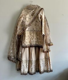 This 3 piece set is made from Raw Silk with handwork all over. The set comes in a shirt, sharara, and dupatta. Can be customized.  We also do custom orders, reach out to us to learn more. Semi-stitched Palazzo Set With Dupatta For Wedding, Embroidered Sets For Wedding And Diwali, Raw Silk Dress With Gota Work For Wedding, Bollywood Style Embroidered Sets With Traditional Drape, Wedding Palazzo Set With Dupatta In Jamawar, Wedding Jamawar Palazzo Set With Dupatta, Bollywood Sets With Embroidery And Traditional Drape, Raw Silk Wedding Dress With Gota Work, Wedding Dresses In Raw Silk With Gota Work