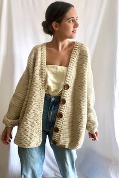 This Beige Oversized cardigan, has a gorgeous V neckline and is 100% handmade. This wool cardigan has a beautiful clousure with gorgeous dark wooden buttons. This hand crocheted jacket is made with hight quality yarn, antiallergic and super super soft. This amazing oversize cardigan is the gargment that you would want wear it forever! Perfect to wear it with dresses or with a jean! Super comfy, stylish and versatile! WHICH IS MY SIZE? This cardigan is One size fits all (S-L).  If you are not sure if it fits you, here you have the measurements of the back and the lenght. The width from shoulder to shoulder is 55 cm/21,6 in and length 75 cm/29,5 in.  If you can't find your size or you are not sure about the size, contact me and I will make the one that fits your measurements. HOW TO KEEP YOU Beige Chunky Knit Cotton Cardigan, Oversized Beige Cotton Cardigan, Beige Oversized Cotton Cardigan, Beige Bohemian Chunky Knit Sweater, Beige Knitted Sweater Coat, Casual Cream Crochet Cardigan, Handmade Oversized Sweater, Cream Crochet Outerwear For Winter, Handmade Oversized Sweater Coat