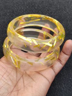 You will receive 2 pcs set Transparent Yellow Resin Bangle Bracelet Purely Handcrafted Exclusive Retro Wide Bangle Trendy Unique Fashion Jewelry for Women.  Bangle innerdiameter Size:  2.6" Approx. Bangle Width Siz : 19 mm  Many thanks for you visit my store ♥ if you have any question please contact us. For wholesale Price Please Convo me. You can order different items as many you like . Plastic Bangle Jewelry For Party, Yellow Plastic Party Jewelry, Resin Bracelets As Gifts, Adjustable Resin Bangle, Gold Resin Bracelet, Plastic Round Jewelry For Parties, Round Plastic Party Jewelry, Adjustable Resin Bangle Jewelry, Handmade Plastic Bracelets For Party