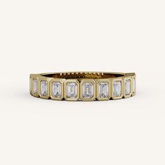 a yellow gold band with baguets and diamonds