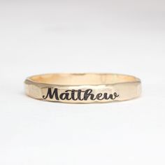 Simple name stacking rings with a satin finish. Made with .925 sterling silver, 14K gold filled, or 14K rose gold filled. Rings are approximately 2.5mm wide. Listing is for one ring Please message me if you would like a different font. These rings are made of high quality materials. The colors will not chip off or fade and can be worn in water. This ring is made to order in your size. If you don't see your size available please feel free to message me. All orders ship in a gift box. If you are o Everyday Gold Hand Stamped Stackable Rings, Adjustable Sterling Silver Engraved Ring Stamped 14k, 14k Yellow Gold Engraved Ring With Hand Stamped Details, 14k Yellow Gold Hand Stamped Engraved Ring, Hand Stamped 14k Gold Ring, Hand Stamped 14k Gold Engraved Ring, Hand Stamped 14k Yellow Gold Engraved Ring, Customizable Gold Engraved Ring For Everyday, Customizable Gold Engraved Ring For Everyday Wear