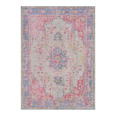 an area rug with various colors and patterns on the ground, including pinks, blue,