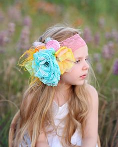 Glam up your photoshoot or just your trip to the store with this floral, feather headband designed with a stretchy elastic lace band for a stay-put fit. ♥ Spot clean ♥ Due to each headpiece being handmade, not all headbands will look exactly like the photo shown. This makes each headpiece more unique.   ♥ Please Note: Our headpieces may contain small parts, always supervise little ones when they are wearing our products. Summer Adjustable Handmade Flowers Headband, Summer Adjustable Headband With Handmade Flowers, Adjustable Summer Headband With Handmade Flowers, Adjustable Flower Headband For Summer, Adjustable Flower Hair Accessories For Summer, Summer Handmade Flower Hair Accessories, Handmade Flower Hair Accessories For Summer, Multicolor Spring Headband, Multicolor Headband For Spring