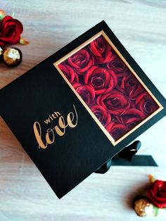 there is a card with roses on it and the words with love written in gold