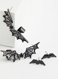 FIT 2” long. MATERIALS + CARE Base metal. Imported. DETAILS Bat shaped. Crawler and stud design. WHY WE LOVE IT Flaunt your haunt with this bat earring set from the Halloween capsule! . The best plus size women's black bat ear crawler and stud earrings in black. Torrid is your destination for cozy fall and winter clothes to keep you warm and comfortable. Bat Jewelry, Ear Crawler, Stud Design, Bat Earrings, Ear Crawlers, Belly Jewelry, Black Bat, Accessories Jewelry Earrings, Shopping Day