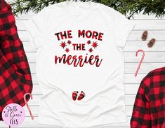 Christmas Pregnancy Announcement Shirt, The More The Merrier Shirt, Funny Xmas Baby Reveal, Pregnant Top, Winter Pregnancy ShirtWelcome to Stella & Grace Tees! This listing is for ONE (1) unisex t-shirt that says “The More the Merrier” with red plaid lettering, stars and baby feet.★High quality prints that will last★Comfortable & flattering fit★ Soft and Light weight, with just the right amount of Stretch★Machine washable & dryer safeSHIRT DESIGN★All of our shirts are created with th Christmas Pregnancy Announcement Shirt, Winter Pregnancy, Christmas Baby Announcement, The More The Merrier, Christmas Pregnancy Announcement, Christmas Pregnancy, Winter Maternity, Pregnancy Announcement Shirt, Maternity Tees