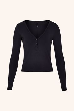 Meet our Cozy Long Sleeve Top: an ultra-soft, body-fitted top with a flattering V-neckline and delicate buttons. Ideal for layering or wearing solo, it transitions effortlessly from lounging at home to stepping out in style. The snug fit and breathable fabric make it a staple for any season, ensuring you stay comfortable and chic. Ultra-soft and body-fitted Classic henley design with V-neckline Delicate button detailing Snug yet breathable fabric Composition: Viscose Spandex Model Measurements: Black Tops For Women Nordstrom, Black Long Sleeve Outfit, Black Long Sleeve Henley, Swan Aesthetic, 2000s Outfit, Clothes Wishlist, Long Sleeve Outfits, Downtown Girl, Bella Swan