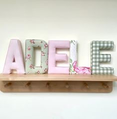 a wooden shelf with letters that spell out the word sale