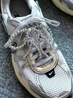 ✨Decorate your Shoes with Handmade Shoes Charms🤍 🪩Silver Beads Tassels Shoelace Charms ୨୧  ⋅  100% Handmade Y2K bowknot𐙚ྀིUnique gift ideas𐙚ྀི౨ৎ 𐙚   Charms may attach anyway/anywhere upon your desire👟 Start create you own personal style Today! Be Bow 🎀 Be Creative Product Detail: ❣️  Color : Silver🪩 and Ivory🤍 ❣️  Quantity : 1 pair [2pcs] ❣️  Material : Plastic（Beads）, Metal（Clasp）, Fishing line ❣️  Estimated size : 3.5in * 3.25in    Each Charm has 1 Clasp   Sneakers Jewelry / Multipurp Casual Bling Lace-up Sneakers, Silver Low-top Sneakers With Bling, Silver Bling Low-top Sneakers, Silver Lace-up Party Sneakers, Trendy Silver Sneakers With Bling, Trendy Silver Bling Sneakers, Casual Silver Sneakers With Rhinestones, Silver High-top Sneakers With Bling, Silver Sporty Sneakers For Party