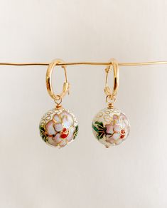 ✤14kt gold filled hoops: 15mm ✤cloisonné charms: 18mm  Artful and eye-catching vintage inspired gold cloisonné drop hoop earrings featuring white floral enamel charms. Small gold filled hoops latch securely.  SHIPPING: ✤I offer FREE shipping within Canada but please note that this does NOT include tracking. If you choose FREE shipping, you risk your package getting lost in transit. If this happens, I CANNOT issue you a refund or replace your jewelry. ✤Only TRACKED orders include tracking. This option is the ONLY method of shipping that ensures you will receive your package or that you can receive a full refund or replacement should your package go missing. GOOD STUFF ✤Become an A/R INISIDER at https://adornedbyruth.com/ to get first peeks at new releases & discounts  ✤Instagram: @adornedby Hoops With Charms, Cloisonne Enamel Jewelry, Embossed Jewelry, Drop Hoop Earrings, All That Glitters Is Gold, Beautiful Abstract Art, Enamel Beads, Gold Filled Hoops, Cloisonne Enamel