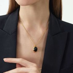 ▼Description The Agate Pendant 18kt gold necklace suspends a striking oval white onyx-a precious stone thought to stimulate imagination and creativity. It has a fine-link chain. ◄Details Composition: 18 kt gold brass/agate18 kt gold chainHeart clasp fastening ◄Size & Fit Chain length: 42cmPendant size: 2*1.5cmExtra length chain: 5cm Adjustable length ◄Shipping Information Free standard shipping on all orders. An average shipping interval for standard delivery is 5-14 working days. Necklace C, Agate Pendant Necklace, White Onyx, Mini Hoop Earrings, Black Agate, Gold Brass, Agate Pendant, Link Chain, Gold Black