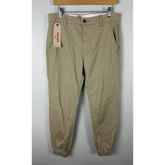 16.5” Across Waistband 29” Inseam Nwt Levis Chino Jogger Tan Pants Mens Size 31 X 32. Tapered Bottoms With Pockets For Spring, Spring Tapered Bottoms With Pockets, Casual Tapered Pants With Welt Pockets, Casual Tapered Bottoms, Fitted Tapered Bottoms With Pockets, Levi's Cotton Bottoms With Hip Pockets, Casual Tapered Chinos With Pockets, Tapered Cotton Bottoms With Pockets, Tapered Cotton Pants With Pockets