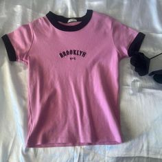 Brandy Melville Pink Brookyln Nyc Embroidered In Black Tee Shirt With Black Piping On Sleeves And Collar Nwot Never Worn Tops Brandy Melville, Black Tee Shirt, Brandy Melville Tops, Brandy Melville, Black Tee, Brandy, Piping, Tee Shirt, Brooklyn