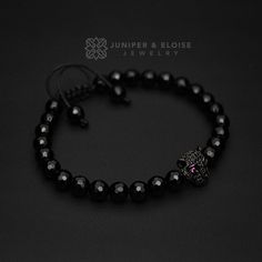 "Handmade bracelet made with 6mm faceted Black Onyx beads featuring rhodium plated tiger with black and fuchsia zircon stones. It's adjustable, utilizing a sliding knot made with macrame cord and is easy to put on and take off by yourself. Please choose one of the 2 size options (For Men or Women) from drop down menu. Men`s Size : 7\" - 8.5\" (18 cm -21 cm) Women`s Size: 6\" - 7.5\" (16 cm -19 cm) All of our jewelry comes in luxury jewelry box and black velvet pouch, ready to gift. All bracelet Black Stretch Bracelet With Faceted Beads As Gift, Black Stretch Bracelet With Faceted Beads For Gift, Faceted Black Crystal Bracelet Gift, Tiger Bracelet, Luxury Jewelry Box, Womens Bracelet, Black Tiger, Black Tigers, Fitness Bracelet