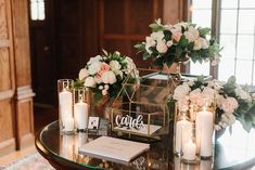 a table with candles and flowers on it