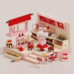 a small toy kitchen with various items on the counter