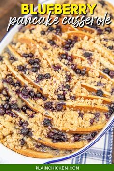 blueberry pancake casserole with crumbled topping in a white dish