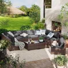 an outdoor living area with furniture and potted plants