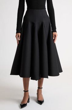 Godet pleats enhance the dramatic volume of this silk-enriched A-line skirt crafted from Valentino's signature crepe couture fabric. This runway-showcased skirt is part of Pierpaolo Piccioli's 'Le Noir' collection—rendered entirely in timeless, powerful black. Hidden back-zip closure 65% virgin wool, 35% silk Dry clean Made in Italy Designer Clothing Evening A-line Skirt With Box Pleat, Pleated A-line Maxi Skirt For Evening, Modern A-line Lined Skirt, Silk A-line Pleated Skirt, Silk A-line Bottoms For Formal Occasions, Formal A-line Silk Bottoms, Elegant A-line Maxi Skirt With Pleated Hem, Voluminous A-line Skirt With Pleated Hem, Evening Pleated Asymmetrical Skirt