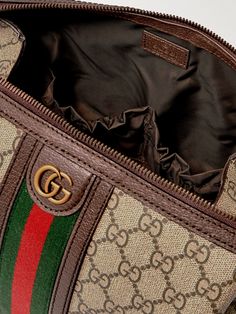 Gucci's wash bag is a stylish way to keep your grooming essentials organised whether you're at home or travelling. It's been made in Italy from durable 'GG' coated-canvas and trimmed with leather and striped webbing. The lined interior boasts multiple slip pockets for securing smaller items. Summer Sunglasses, Gucci Accessories, Gucci Leather, Toiletry Bags, Fine Jewelry Designers, Luxury Gifts, Wash Bags, Leather Trims, Accessories Watches