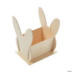 a wooden toy with two ears sticking out of it's sides and one in the shape of a rabbit