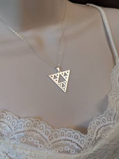 Sierpinski Triangle Necklace in Gold or Silver Purchase includes a natural jewelry box and gift packaging.  Add-on extender: https://www.etsy.com/listing/197483038/add-on-necklace-extender-chain-with Necklace longer than 20 inches: https://www.etsy.com/listing/196689227/extend-my-necklace-up-to-30-inches Turn pendant into a keychain or ornament: https://www.etsy.com/listing/1003597263/turn-any-pendant-into-a-key-chain-or ★ ITEM DETAILS ★ Chain: 18-inch Snake in either Sterling Silver or Gold Filled (Your Choice!) Pendant: Stainless Steel Plated with Silver or Gold Sterling Silver jewelry is an alloy that contains a mixture of 92.5% pure silver and 7.5% of another metal, usually copper. Sterling silver is safe for sensitive skin; however it must be stored in a dry dark place as overtime it Modern Necklace With Large Pendant As Gift, Unique Triangle Sterling Silver Jewelry, Silver Triangle Metal Necklace, Unique Sterling Silver Necklace As Gift, Unique Sterling Silver Necklace For Gift, Modern Silver Necklaces For Gifts, Symbolic Silver Jewelry For Birthday Gift, Symbolic Silver Necklace Gift, Handmade Sterling Silver Triangle Jewelry