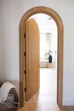 an open wooden door leading into a living room