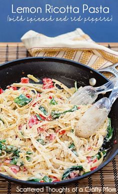 lemon ricotta pasta with spinach and red peppers in a skillet