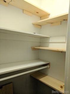 an empty shelf in a room with no furniture