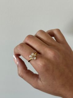 Flower ring - This adjustable dainty flower ring is incredibly stunning. Made to sparkle and shine on any finger! A perfect gift for women, girlfriend, best friends, sisters, moms. A perfect option for those who like minimal dainty gold rings and want to have the perfect size. - gold filled - stainless steel and gold - cz stones - minimalist - adjustable WHY VASI Jewelry? - Ethically sourced gems and stones - Made with recycled gold - Handmade or designed/sourced - Shop local (based in Chicago) Dainty 14k Gold Flower Ring For Wedding, Dainty Cluster Ring With Rose Cut Diamonds For Promise, Delicate Spring Flower Ring, Dainty Adjustable Ring For Promise, Dainty Adjustable Rings For Promise Occasion, Delicate Cubic Zirconia Crystal Ring, Delicate Flower Ring For Spring Gift, Rose Gold Flower-shaped Rings With Cubic Zirconia, Rose Gold Flower-shaped Cubic Zirconia Rings