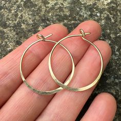 These Hammered Gold Hoop Earrings are handmade in my little studio. They feature a subtle hammered edge and shiny finish. The 14k Gold Filled Hoops are 1mm thick, and sit comfortably in the ear. Each pair is around 26mm wide. Your earrings will be delivered in a recycled, branded jewellery box ready for gifting. Delivery These hammered earrings are ready to be shipped.  See other earrings in my shop here https://www.etsy.com/uk/shop/MineralsRockStudio -What is gold filled?- Gold filled is a proc Branded Jewellery, Handmade Hoop Earrings, Hammered Earrings, Gold Filled Hoops, Hammered Gold, Handmade Gold, Gold Hoops, Gold Filled Jewelry, Jewelry Earrings Hoops