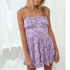 Didn’t Come With Tag But Has Never Been Worn! Purple Sleeveless Sundress For Summer, Purple Summer Sundress For Day Out, Chic Purple Mini Dress For Summer, Purple Flowy Sundress For Summer, Purple Mini Sundress, Lavender Mini Length Dress For Day Out, Purple Spaghetti Strap Beach Dress, Summer Purple Sundress, Fitted Purple Dress With Tie Back