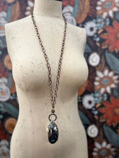 Add a boho flair to your look with our beautiful Practice Makes Pretty necklace featuring a long chain with a ring of coins, crystals, trinkets and a slice of black agate. Get your boho vibes flowing with this beautiful necklace. Approximately 38" w/ 4.5" dangle. Bohemian Chain Jewelry, Bohemian Dangle Chain Necklace With Adjustable Chain, Bohemian Dangle Chain Necklace, Bohemian Metal Lariat Necklace With Chain, Long Crystal Necklace With Adjustable Chain, Bohemian Adjustable Chain Necklace, Bohemian Black Chain Jewelry, Bohemian Long Adjustable Chain Necklace, Adjustable Bohemian Pendant Chain Necklace