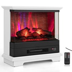 an electric fireplace with red and blue lights in front of it next to a remote control