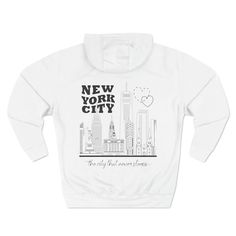 The New York City Skyline Premium Pullover Hoodie has original artwork printed on the front and back in a variety of color combinations. This cozy sweatshirt is perfect for those who love NYC. The front features a NYC heart logo in the top right corner. The back has a full panel design with a simple line drawing of the New York City Sky line with text: 'The city that never sleeps'. Beat the cold with this premium pullover hoodie that's just the right layer of warm and cozy. Made with three-panel fleece lining, this pullover is double stitched for durability and roomy. Pick one in your favorite color to match your style.  Colors: Pale Pink hoodie / Bright Pink Print Navy Blue hoodie / Light Blue Print Royal Blue  hoodie / Black Print White hoodie / Black Print Black hoodie / Gold Print Grey Custom Artwork Long Sleeve Hoodie For Streetwear, Long Sleeve Top With Custom Artwork For Streetwear, Casual Hoodie With Custom Artwork For Streetwear, White Custom Artwork Long Sleeve Sweatshirt, White Long Sleeve Sweatshirt With Custom Artwork, Simple Line Drawing, Navy Blue Hoodie, Ville New York, I Love Nyc